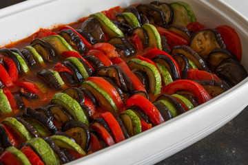 Ratatouille - traditional French Provencal vegetable dish cooked in oven. Diet vegetarian vegan food - Ratatouille casserole.