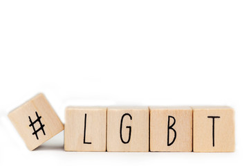 Wooden cubes with a Hashtag and the word LGBT isolated on white, lesbien,gay,bisexual,transgender...