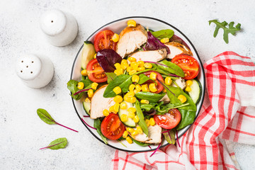Salad with Chicken and vevetables on white.