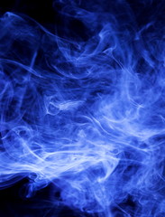 Blue smoke on black background