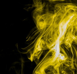 Yellow smoke on black background