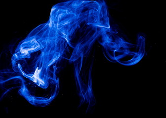 Fototapeta premium Blue smoke on black background