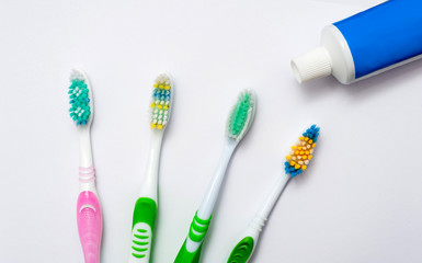 Various toothbrushes on a white background.