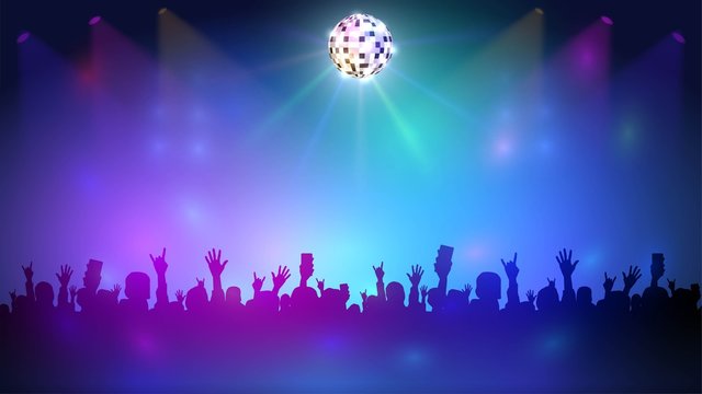 Night club with a crowd and disco ball, music event and dance