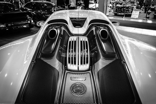 STUTTGART, GERMANY - MARCH 17, 2016: The engine compartment of a mid-engined plug-in hybrid sports car Porsche 918 Spyder, 2015. Close-up.. Europe's greatest classic car exhibition "RETRO CLASSICS"