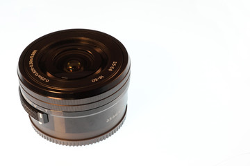 A 16-50mm zoom lens isolated on white background