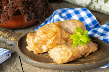 Authentic homemade stuffed cabbage rolls on wooden table