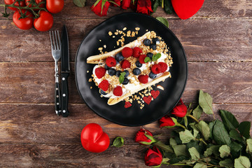 Sweet Homemade Banana Split with yogurt, granola, berries and mint. Banana Split with healthy ingredients