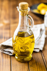 Olive oil in glass bottle.