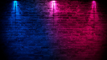 Old brick wall with neon lights. Neon shapes on brick wall background. Dark empty room with brick...