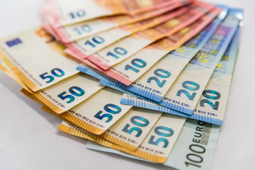 Euro banknotes isolated over white with clipping path