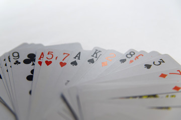 Playing cards in hand isolated on white background