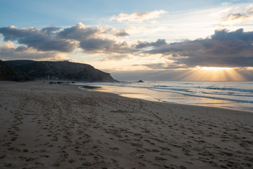 Praia do amado beach at sunset in Costa Vicentina, Portugal