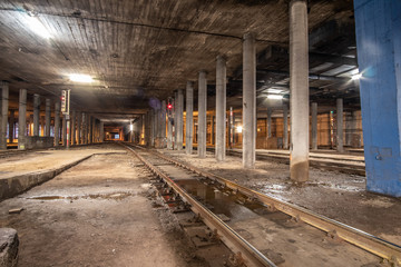 Big empty railway tunnel with many tracks near the underground railway station. Inside railway tunnel.