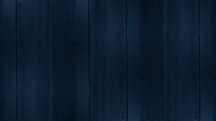 Wood texture in blue classic color. Dark wood, wooden dark background. Dark room with wooden walls.
