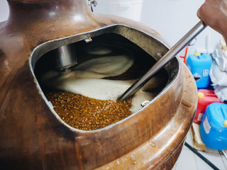 Brew of craft beer at vat in brewery