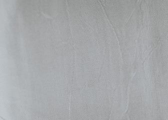texture of a white curtain lit with outside light