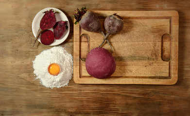 Purple dough bun for noodles with ingredients on the table.