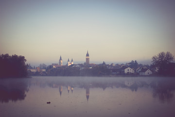 Naklejka premium Reflection of a Central Bohemian town in a pond