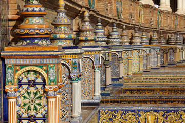 The tiled Provincial Alcoves in Plaza de España (Spain Square) in Seville, Spain - obrazy, fototapety, plakaty