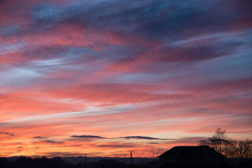 Pink sunset. Wonderful drawing of clouds. Pink clouds