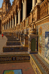 The tiled Provincial Alcoves in Plaza de España (Spain Square) in Seville, Spain