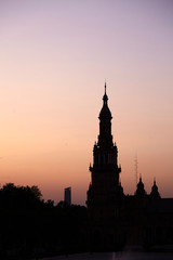 Naklejka premium The tower at sunset in Plaza de España (Spain Square) in Seville, Spain