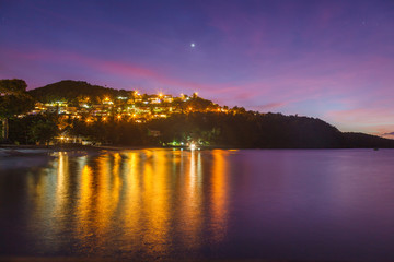 Colorful dusk sky over Anse a l’Ane beach and calm bay with peaceful Caribbean sea, Martinique island, Lesser Antilles