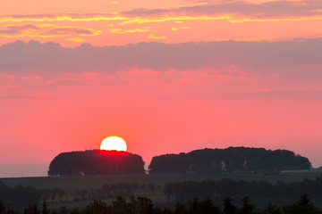 Obraz premium roter Sonnenaufgang Feld