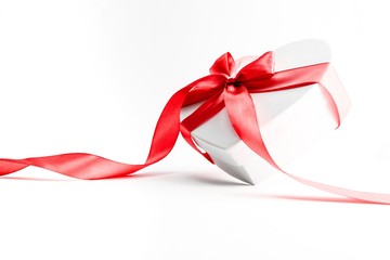 Valentines day background. White gift box with bow and red ribbon heart, photo template, background. Top View.