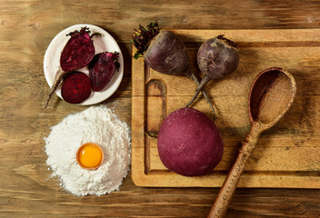 Purple dough bun for noodles with ingredients on the table.