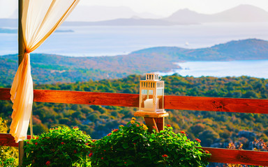 Sunrise or sunset at Cafe or Restaurant veranda near Porto Rotondo on at Mediterranean sea in...