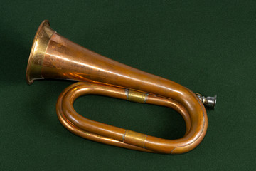 Old Calvery Bugle copper and brass on green background