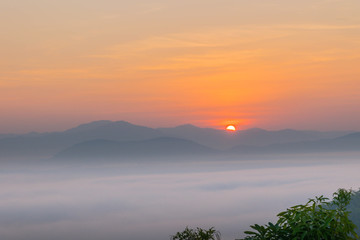 Naklejka premium Silhouette the sunrise with the fog, beautiful sky and cloud at Phu Lam Duan Mountain, Pak Chom District, Loei Province, Thailand.
