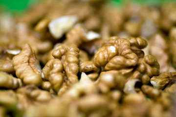 Walnuts on green background