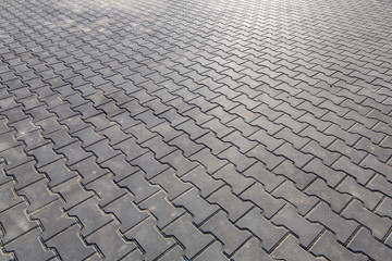 paving slabs of gray color pedestrian square paved with stone, closeup of empty space.