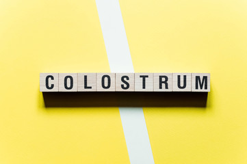 Pills capsules with colostrum, on a white background