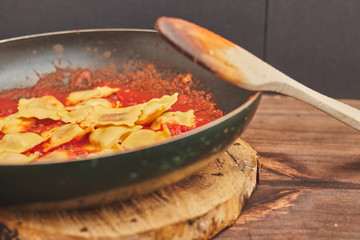 Closeup of a tasty pasta in vegetables sauce in a pan