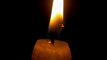 candlewick Macro. Candle flame on black background isolated 