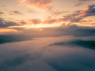 Fototapeta na wymiar orange yellow morning colors skyscape.drone shutt sunrise fog and mist landscape