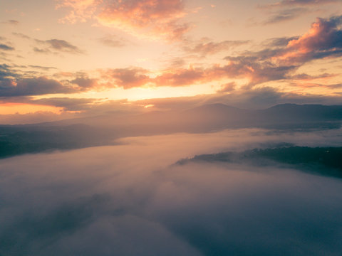 orange yellow morning colors skyscape.drone shutt sunrise fog and mist landscape