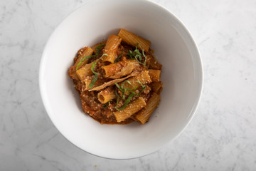 Homemade rigatoni pasta with classic bolognese sauce