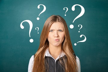 Attractive beautiful woman with question on school background