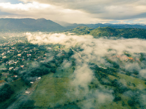 aerial landscape  fog and mist .cloudy morning in jarabacoa,dominican republic.el mogote mountain ,small village and in background
