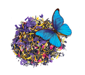 heap of tea leaves and flower petals isolated on a white. blended tea close up. beautiful blue...