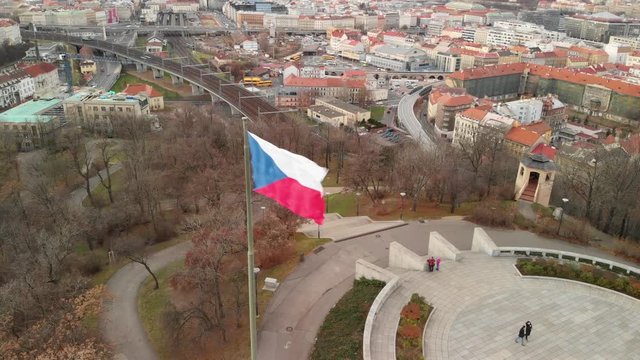 Prague, Czech Republic. Country Flag Waving on Strong Wind on Vitkov Hill, Drone Aerial View With Florenc District in Background