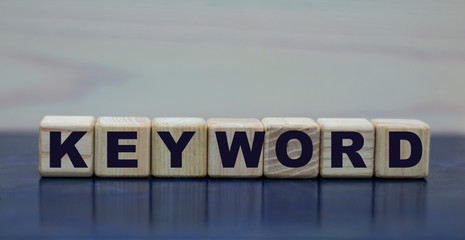 concept word keyword on wooden cubes on a beautiful background