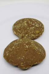 Close up view of Gula merah aren jawa or Jaggery palm Gulo Saka, red brown sugar. Traditional Indonesian food beverage dessert ingredients sweetener. Sweet tasty made from tree sap. Dense sticky thick