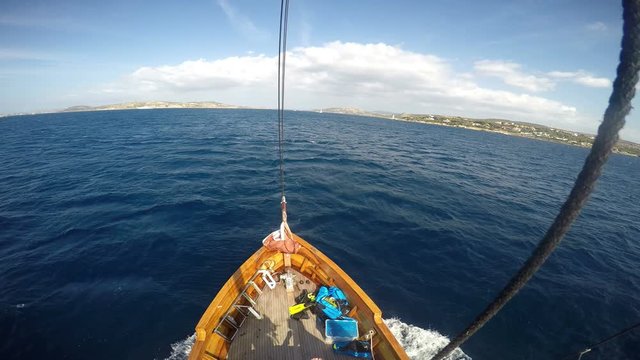 Ocean sail boat sailing on the sea above the deck from the mast
