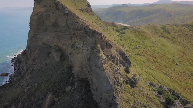 Aerial orbit around the Castle Rock landmark on the east coast of New Zealand